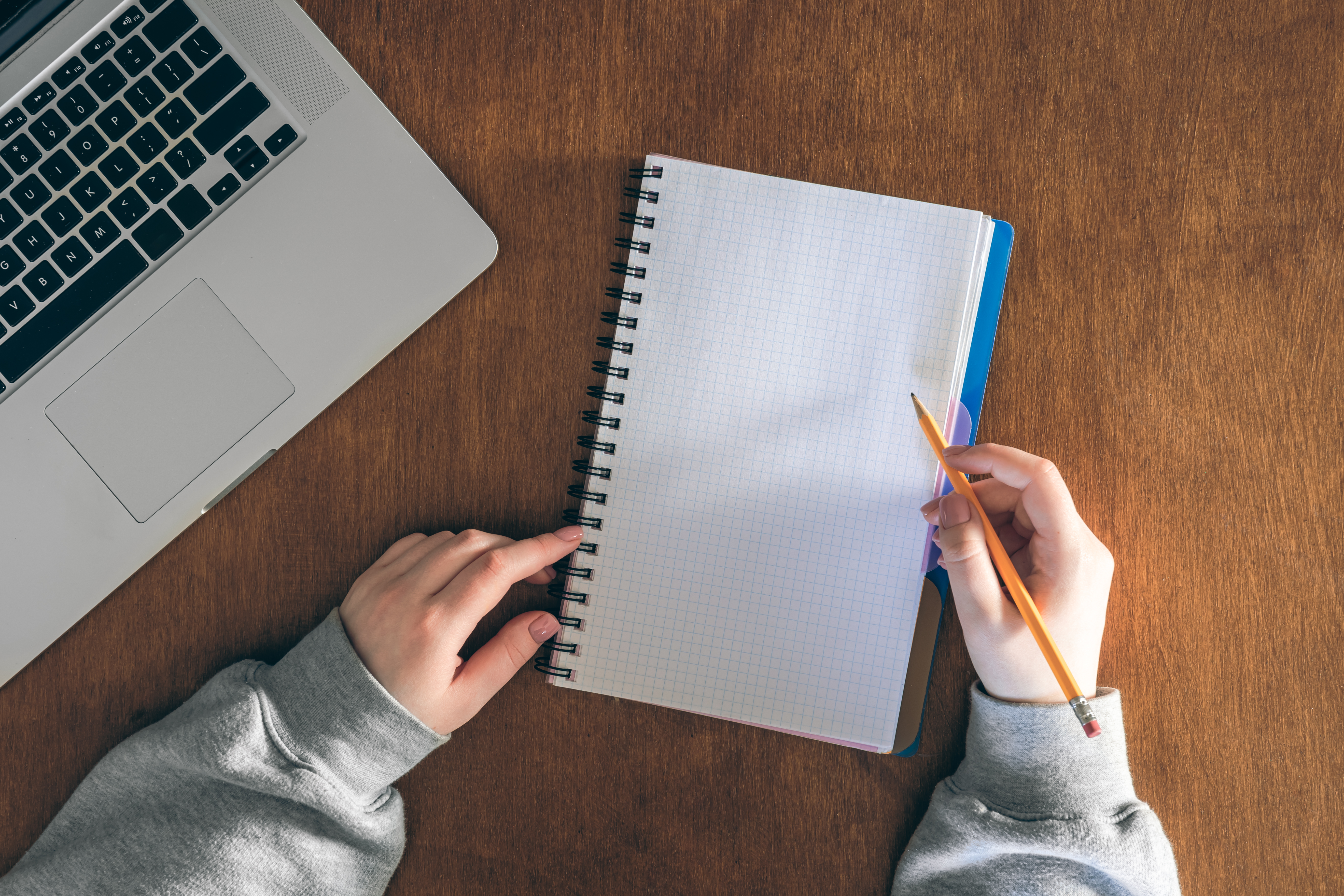 Blank Notepad Pencil Female Hands Table With Laptop Top View
